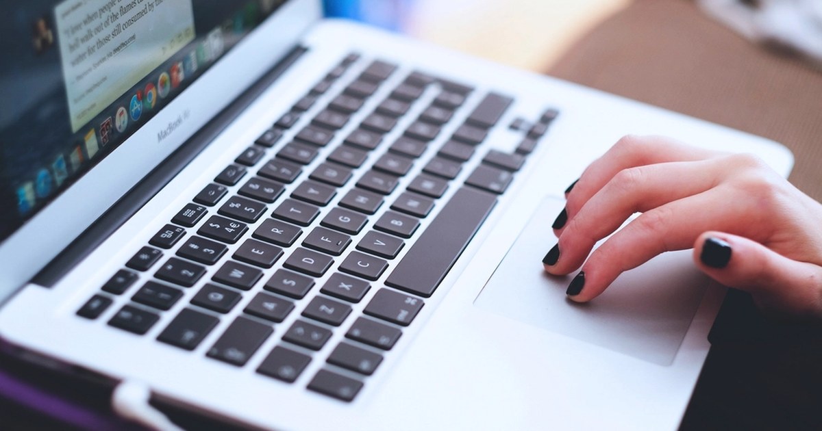 Person using a laptop, illustrating online casino account verification and safe gambling