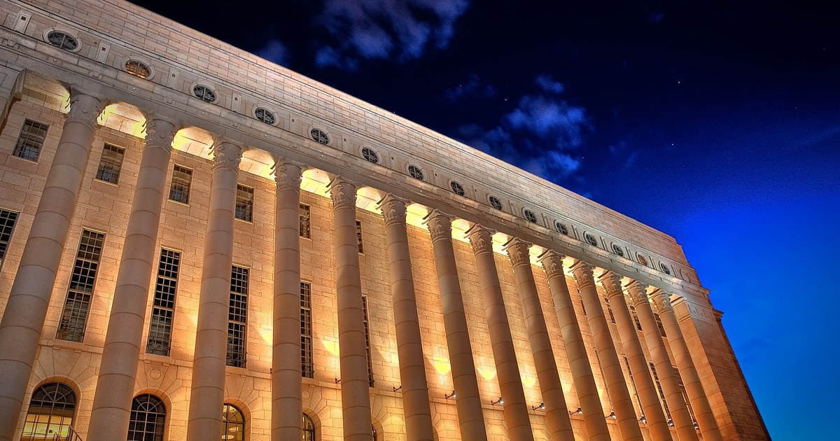 The Finnish Parliament House lit at night in Helsinki